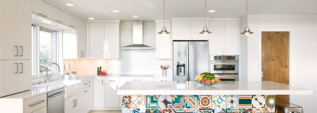 photo of white kitchen with colorful tile